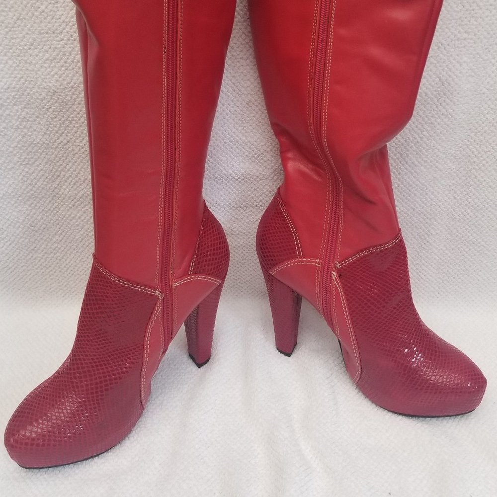 Tall  red leather boots. New and unworn.